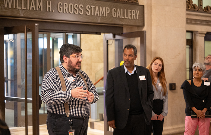 Daniel Piazza G’04 (Chief Curator of Philately, Smithsonian National Postal Museum) addresses the group before the tour